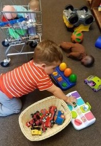 child playing with toys on the floor